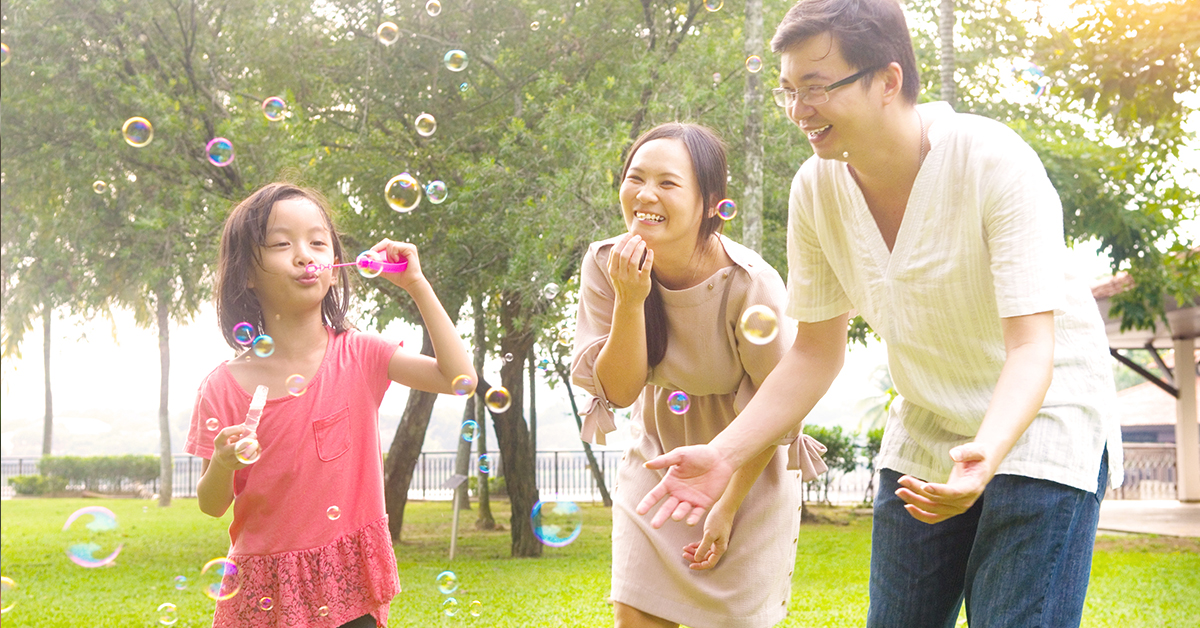 Happy Family Blowing Bubbles in Arlington, TX