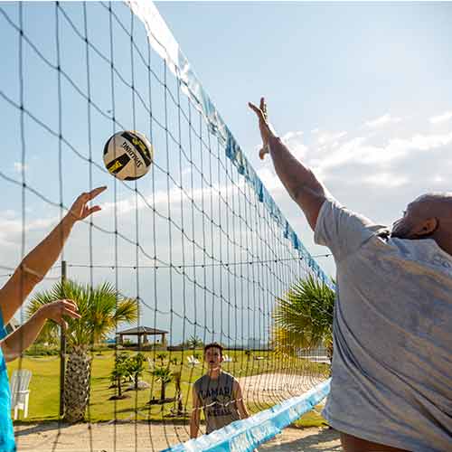 People playing volleyball near Arlington, TX, new homes for sale.