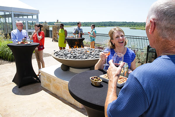 Gather with friends by the lake for a happy hour social