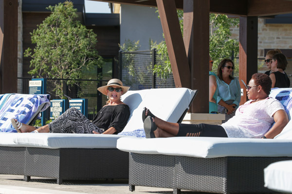 Two ladies lounging by the pool at The Magnolia Lifestyle Center
