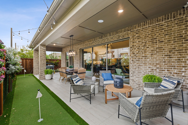 Patio with a dining table, lounge seating and putting green to enjoy