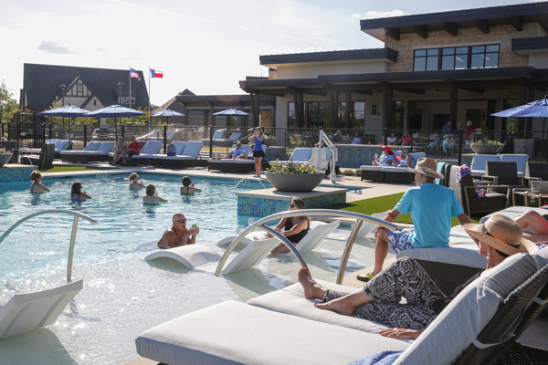 55 active adult community residents enjoy socializing at the pool