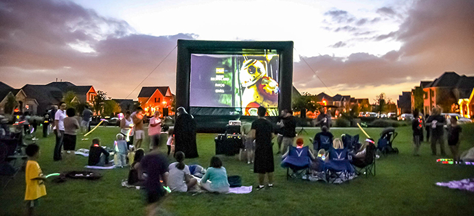 Movie night in parks outside of new homes for sale.